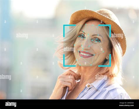 Facial Recognition System Mature Woman With Scanner Frame And Digital