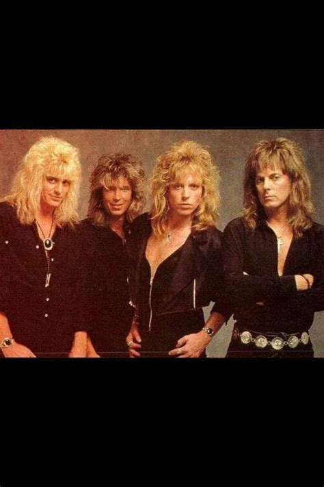 The Band Blond Blondes Posing For A Photo In Their Black Outfits With