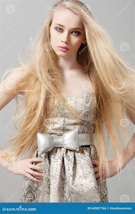 Young Woman With Long Blonde Hair In Fashion Dress Stock Photo Image