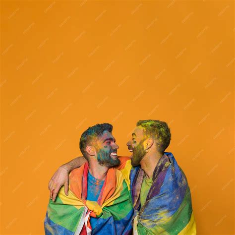 Premium Photo | Laughing dirty cuddling gay lovers