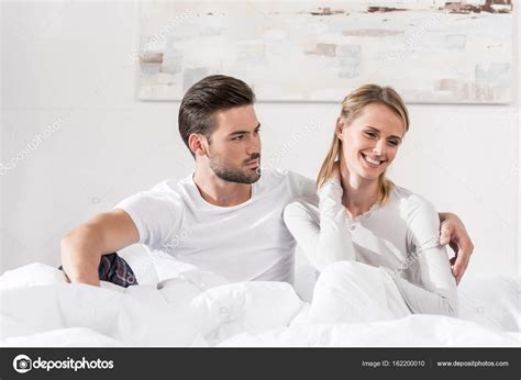 Couple hugging in bed — Stock Photo © AllaSerebrina #162200010