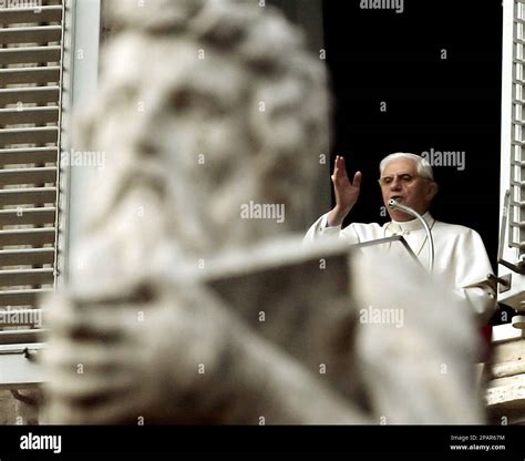 Pope Benedict XVI delivers his blessing during the Angelus prayer in St ...