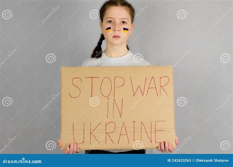 An 11 Year Old Ukrainian Girl Stands With A Poster In Her Hands With