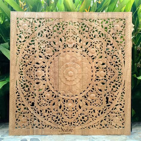 An Intricately Carved Wooden Panel In The Shape Of A Flower With Leaves