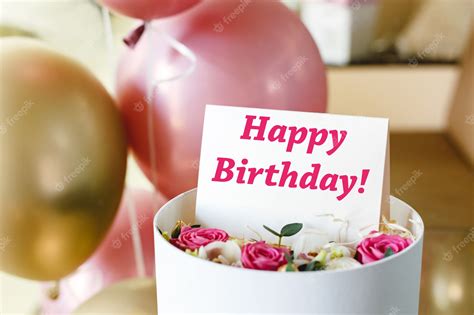 Premium Photo | Happy birthday text on gift card in flower box near ...