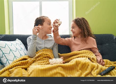 Two Kids Eating Popcorn Watching Movie Home Stock Photo by ©Krakenimages.com 637860964