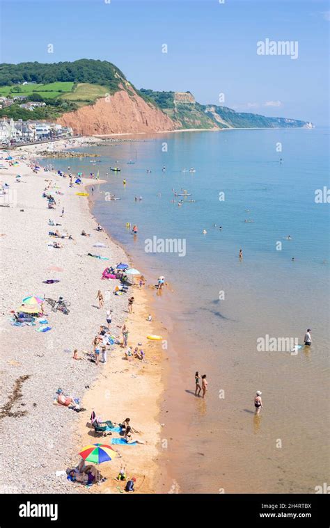 Families on the beach at Sidmouth beach ,a mixture of sand shingle and pebbles Sidmouth Town ...