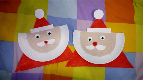 Two Paper Plates With Santa Claus Faces On Them