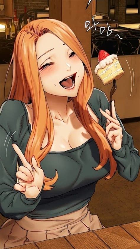 A Woman With Long Red Hair Holding A Piece Of Cake And Pointing To The Side