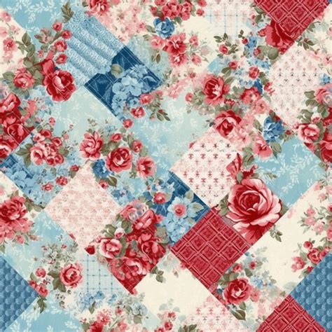 Premium Ai Image A Close Up Of A Patchwork Quilt With Roses And Blue