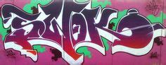 Graffiti Art: Green and Purple Spray Paint