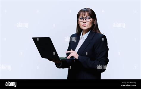 Mature Business Woman Posing With Laptop On White Background Stock Photo Alamy