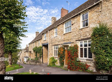 Typical traditional stone buildings on The Hill in the Cotswold town of ...