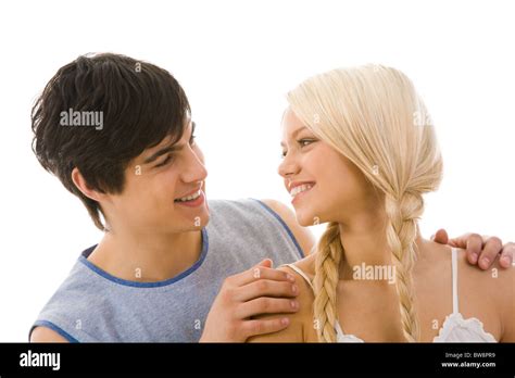 Image Of Beautiful Blonde Looking At Handsome Man While He Embracing