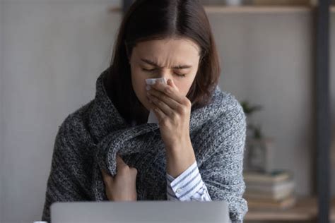 Woman Sneezing Office Stock Photos Pictures And Royalty Free Images Istock