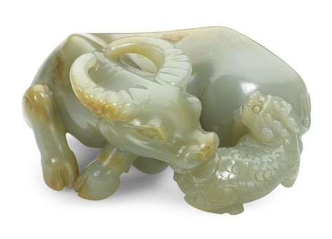 A CELADON JADE BUFFALO AND QILIN GROUPQING DYNASTY Lion Sculpture