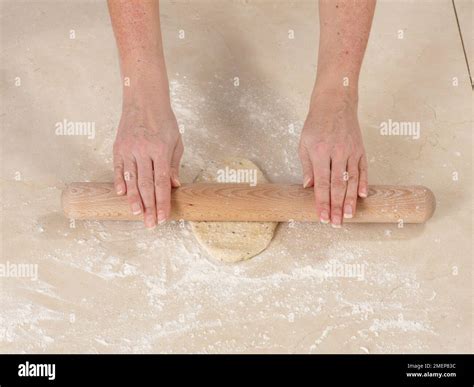 Rolling out pitta bread dough Stock Photo - Alamy