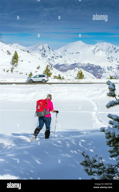 Female In Pink Top Snowshoeing Plateau De Bielle Pyrenees France