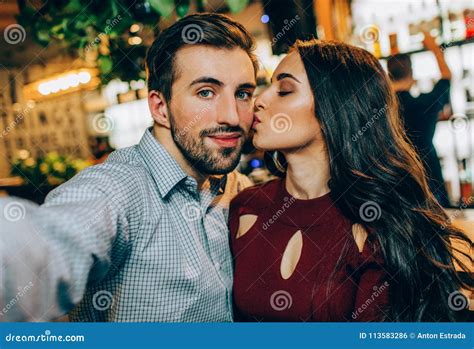 Another Selfie Of Couple Girl Is Kissing Her Partner While He Is