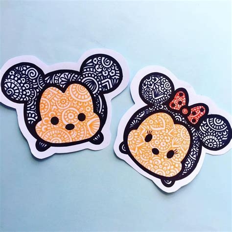 Two Mickey Mouse Stickers Are Shown On A Cell Phone One Is Yellow And