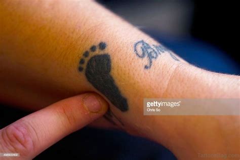 Adorable Baby Footprint Tattoos On Wrist Tattoo Designs