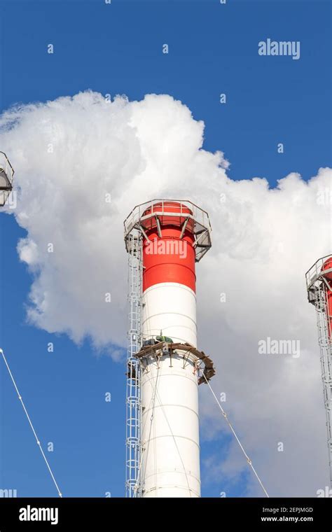 Red White Chimneys Of The Boiler Room Equipped With A Traffic Light