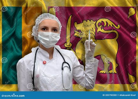 Young Woman Doctor In Medical Uniform On The Background Of The National