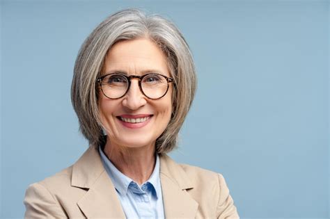 Premium Photo Smiling Senior Business Woman Manager Wearing Eyeglasses Looking At Camera Isolated