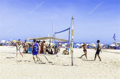 People Playing Volleyball In Copacabana Beach In Rio De Janeiro Brazil