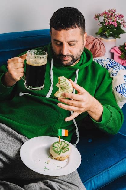 Premium Photo A Single Man Having Donuts And Stout For Breakfast To