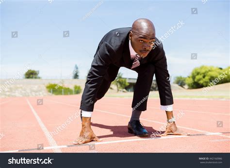 Black Man In Suit Kneeling Over Royalty Free Licensable Stock