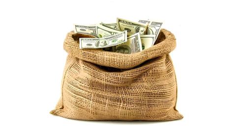 Premium Photo Burlap Money Sack Overflowing With Dollar Bills On A