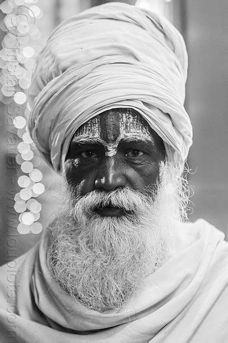 hindu baba with white beard, tilaka and white turban