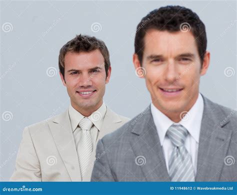 Two Businessmen Smiling At The Camera Stock Photo Image Of