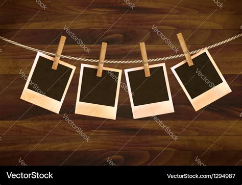 Retro photos hanging on a rope dark wooden Vector Image