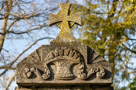 A Cross with an Emblem Carved on a Tombstone Stock Image - Image of ...