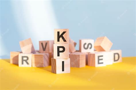 Premium Photo Wooden Cubes With Letters Kpi Arranged In A Vertical