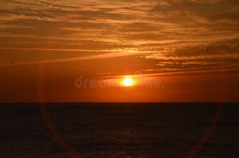 Beautiful Orange Sunset Over The Sea On The Tropical Beach Stock Image