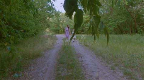 Mom And Daughter Are Walking In The Park Stock Footage Video Of