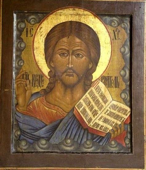 An Icon Of Jesus Holding A Book