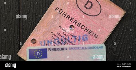 An Old And New German Driving License With The Inscription