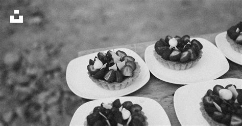 A Table Topped With White Plates Filled With Desserts Photo Free Dish