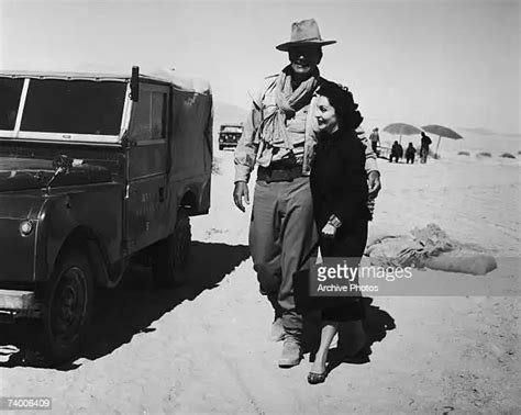 American Actor John Wayne With His Wife Pilar During A Location Shoot