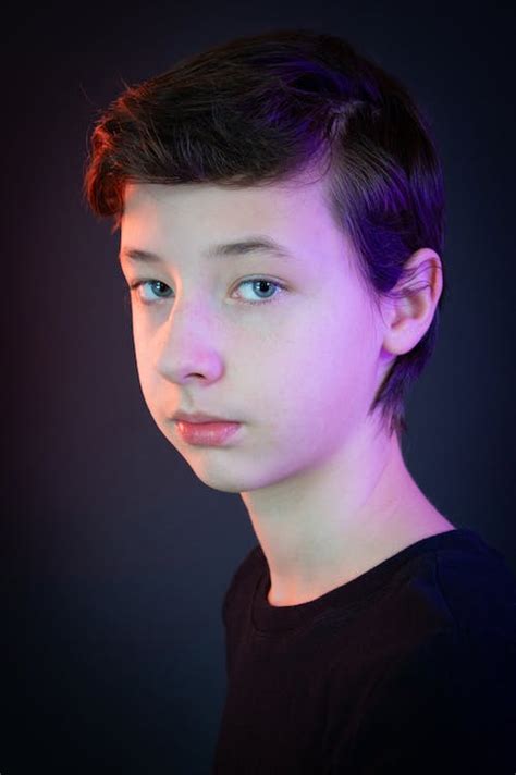 Studio Portrait of a Dark Haired Boy · Free Stock Photo