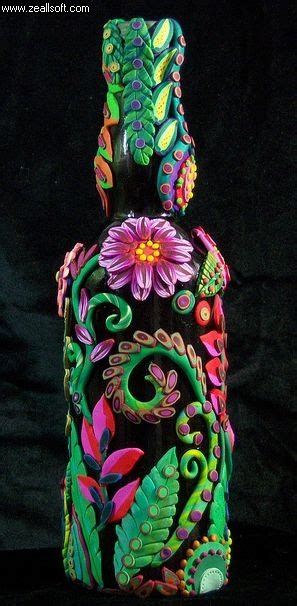 A Colorful Vase With Flowers And Leaves Painted On It S Sides Sitting