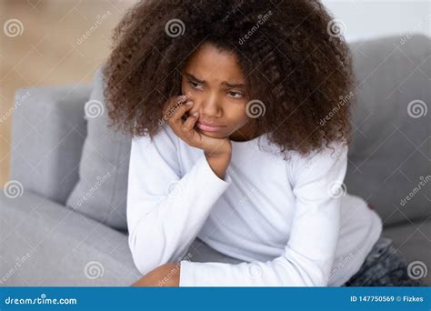 Close Up Upset African American Teenage Girl Sitting Alone Stock Image