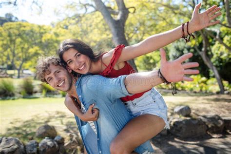 Man Giving A Piggyback Ride To Woman Stock Image Image Of Adult