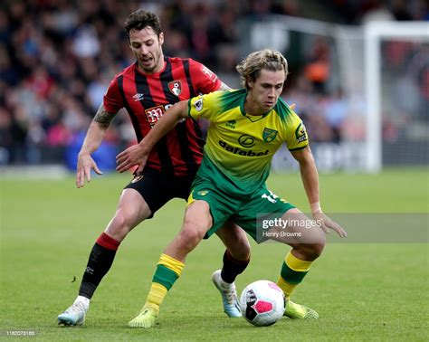 Todd Cantwell Of Norwich City Is Challenged By Adam Smith Of Afc