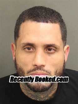 Recent Booking Mugshot For JESUS MIGUEL REYESCARTAGENA In Orange