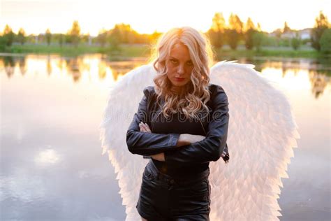 Fallen Angel. Girl in Black with White Angel Wings. Stock Image - Image ...